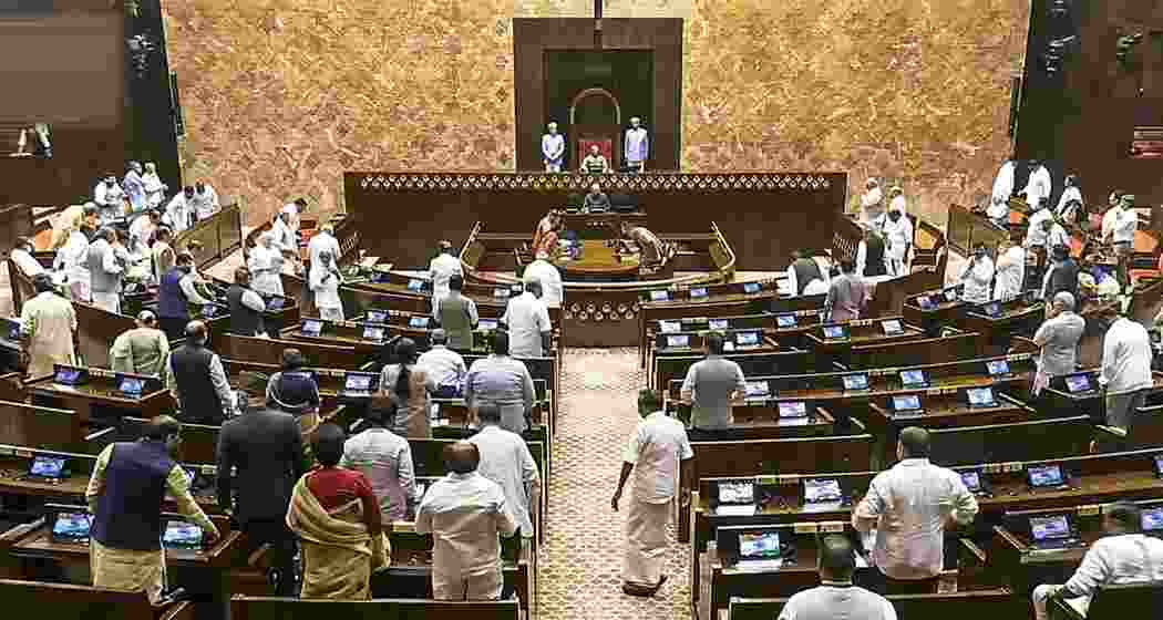 Opposition members protest in the Rajya Sabha during the Monsoon session of Parliament, in New Delhi on Monday.