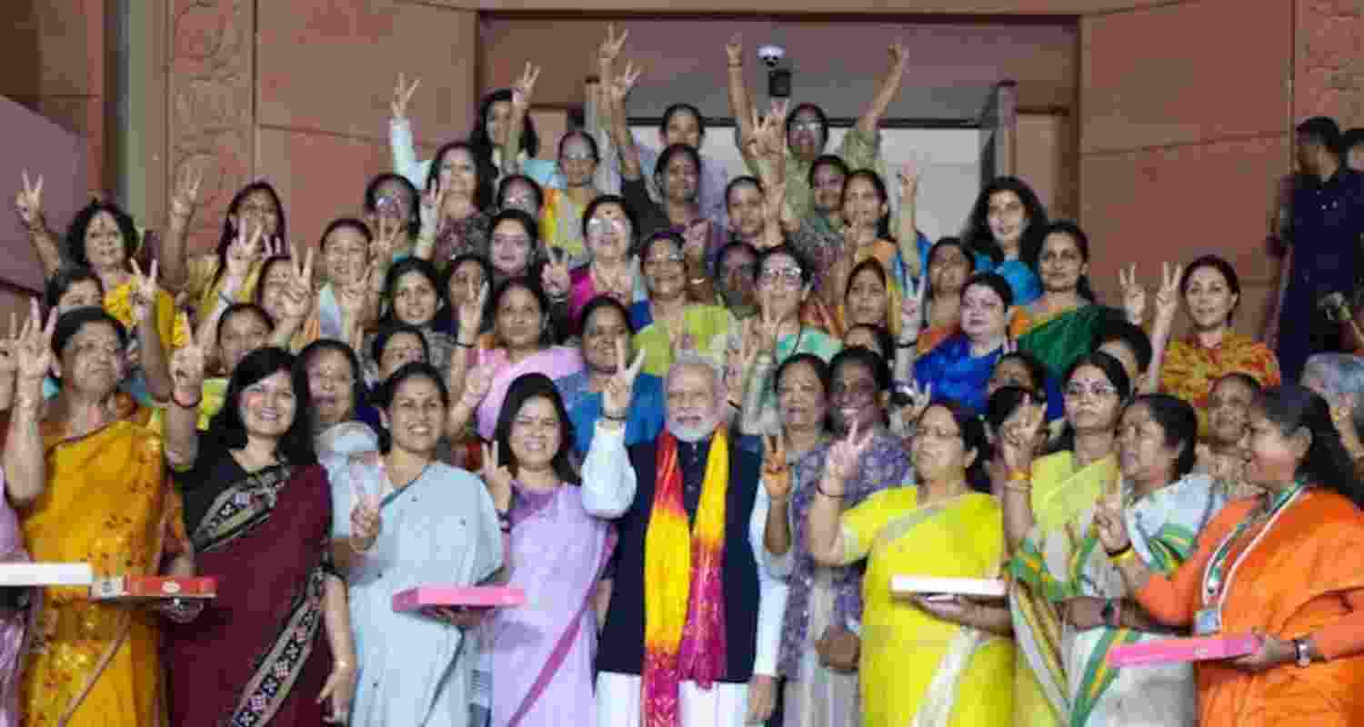 Prime Minister Narendra Modi with women MPs after the Women's Reservation Bill was passed in Rajya Sabha - file image via X.