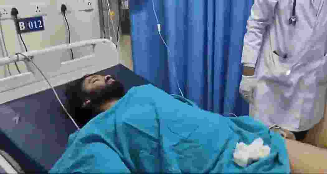 Farhan Ali, the main accused in the Bhopal student rape case, receives treatment at a hospital after being shot in the leg during an alleged attempt to escape police custody.
