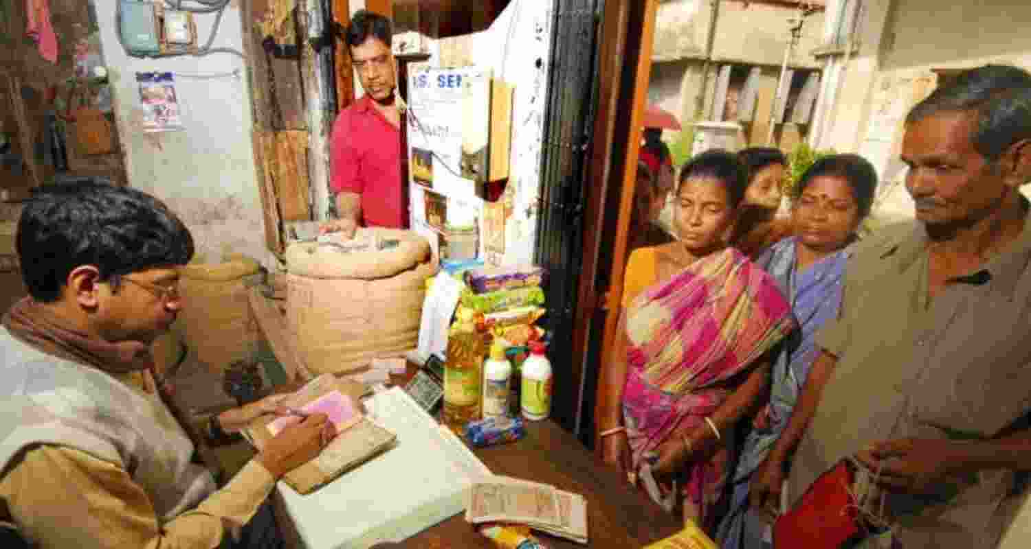 People line up at a ration shop. Image via X.