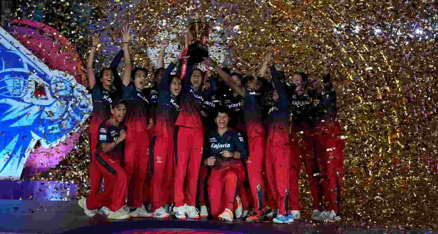 The Royal Challengers Bangalore Women team celebrate their first WPL victory.