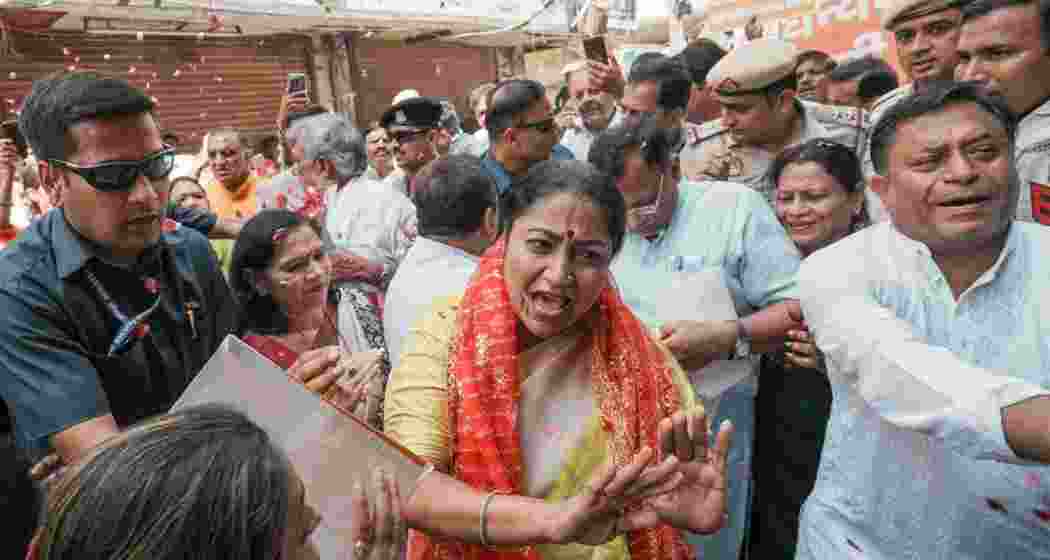 Delhi Chief Minister Rekha Gupta speaks with traders during her visit at Totaram Bazar, Tri Nagar, in New Delhi, Monday.