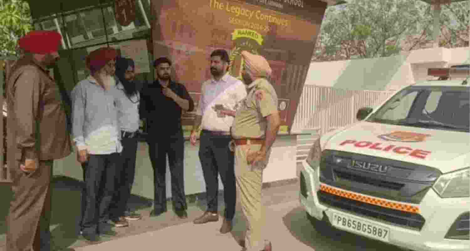 Police personnel conduct search operation at a school in Ludhiana following bomb threat emails on Thursday.