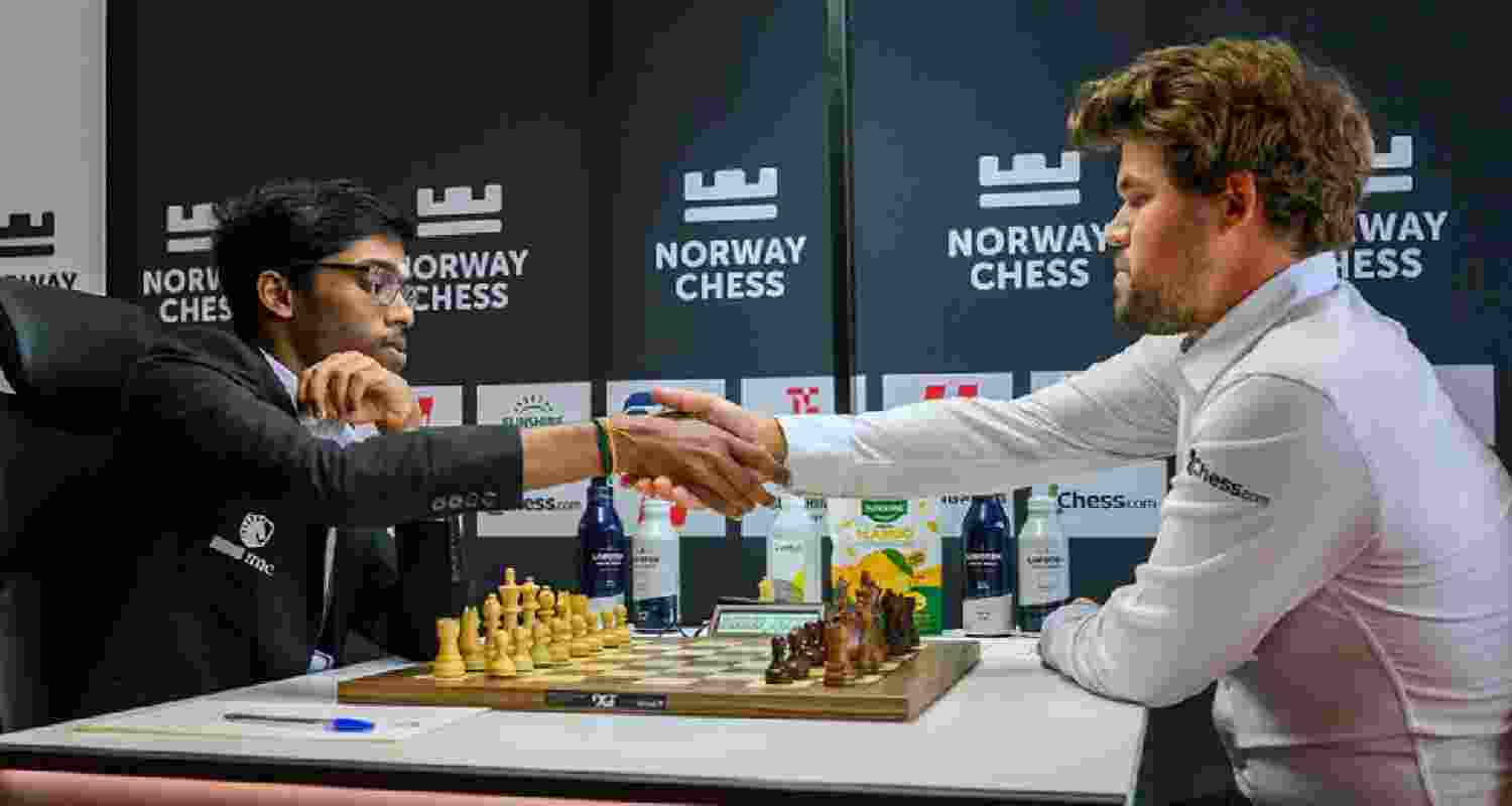 R Praggnanandhaa shaking hands with Magnus Carlsen after defeating the World No. 1 in Round 3 of the Norway Chess tournament.