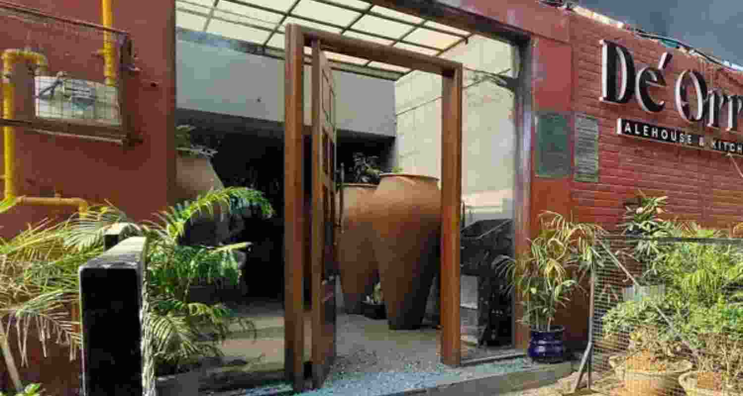 Pieces of broken window glass lie on the floor after an explosion outside a club in Chandigarh, Tuesday.