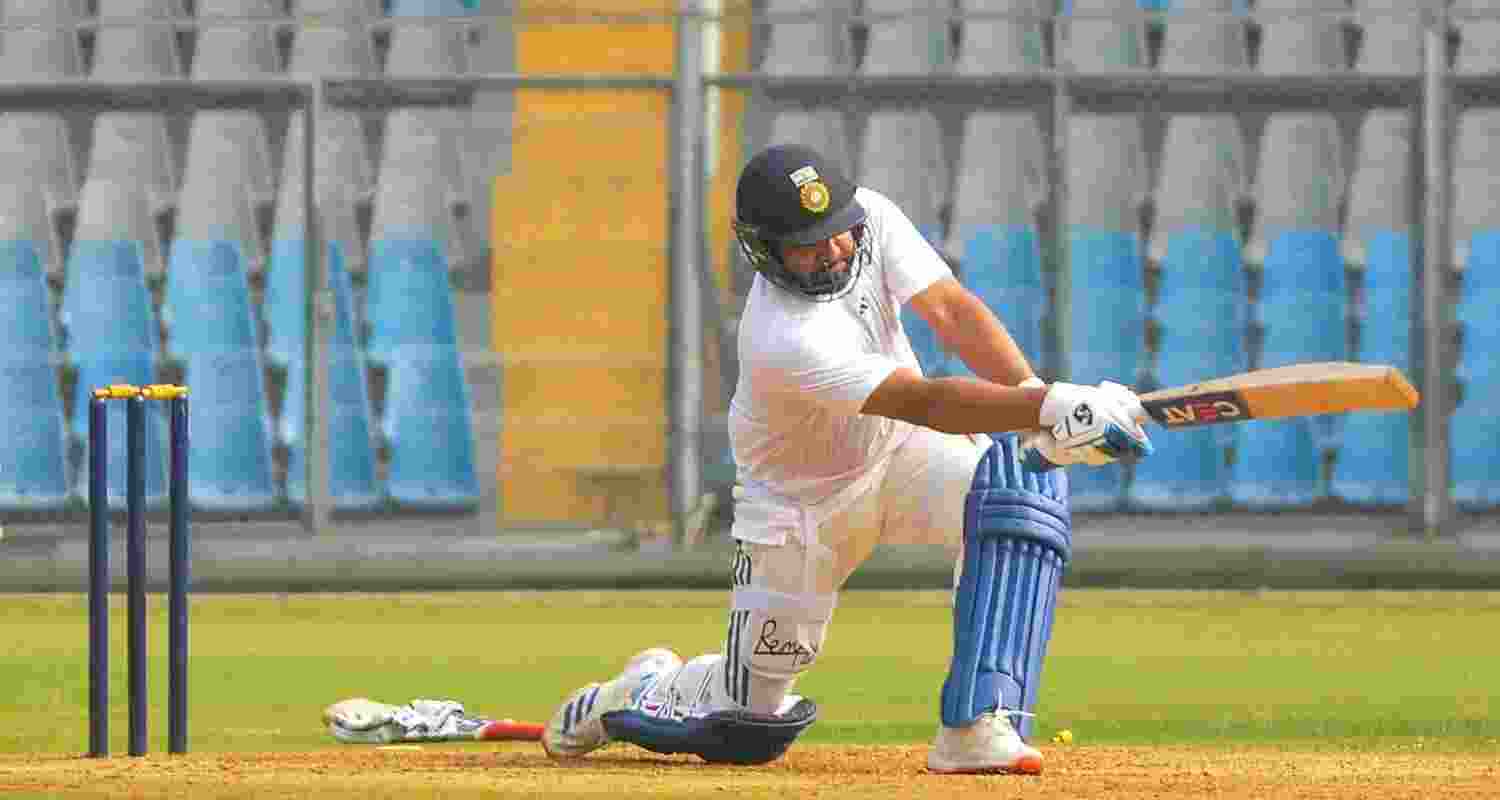  Indian cricketer Rohit Sharma bats during a practice session of Mumbai's Ranji Trophy team, at Wankhade Stadium, in Mumbai, Tuesday.