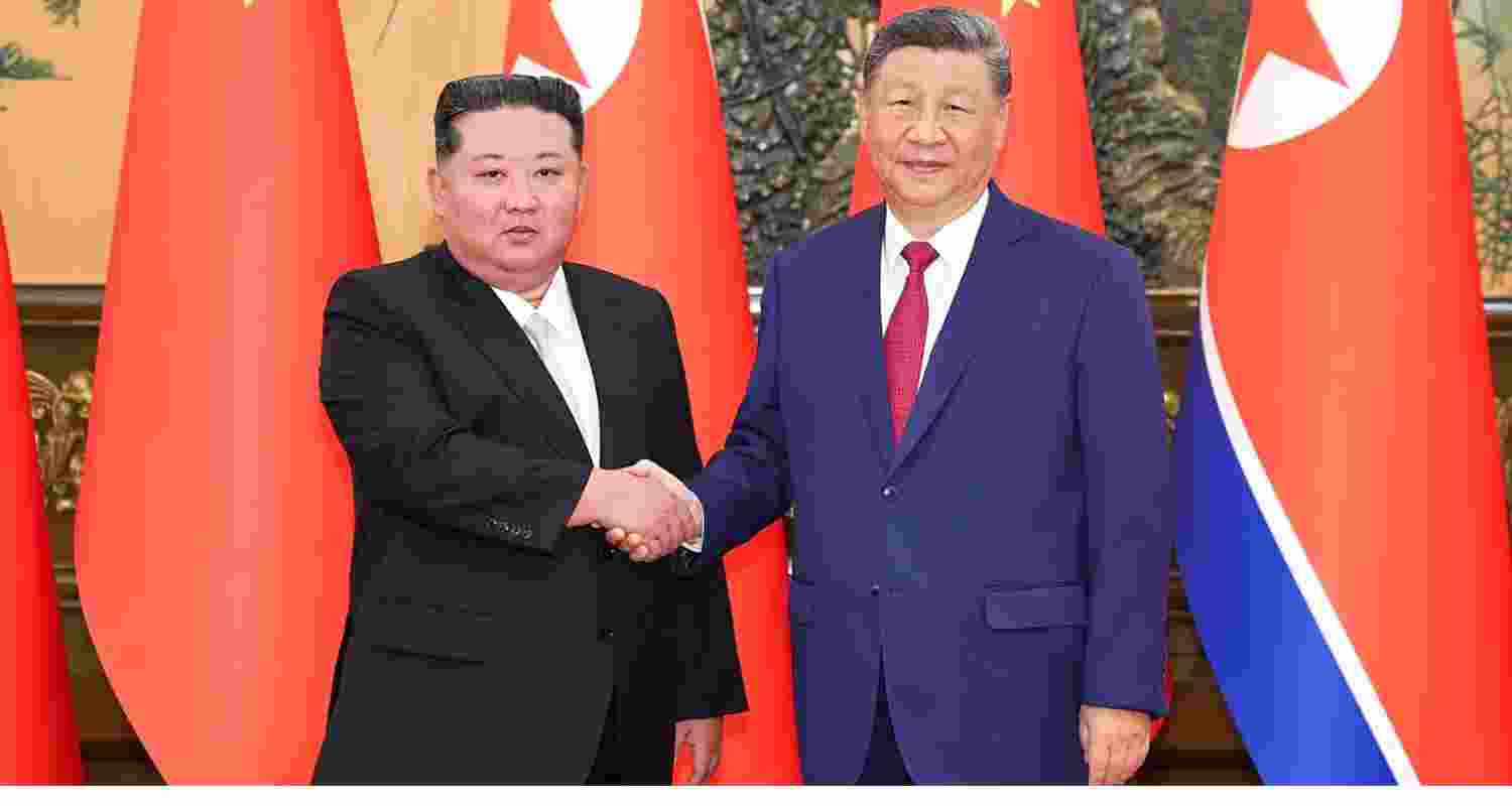 A file photo of North Korean leader Kim Jong Un with China's President Xi Jinping.