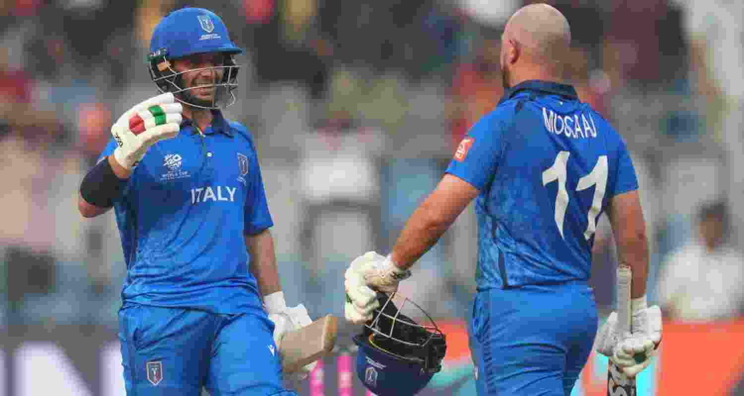 Justin Mosco and Anthony Mosco congratulating each other after taking Italy to victory in their match against Nepal on Thursday.