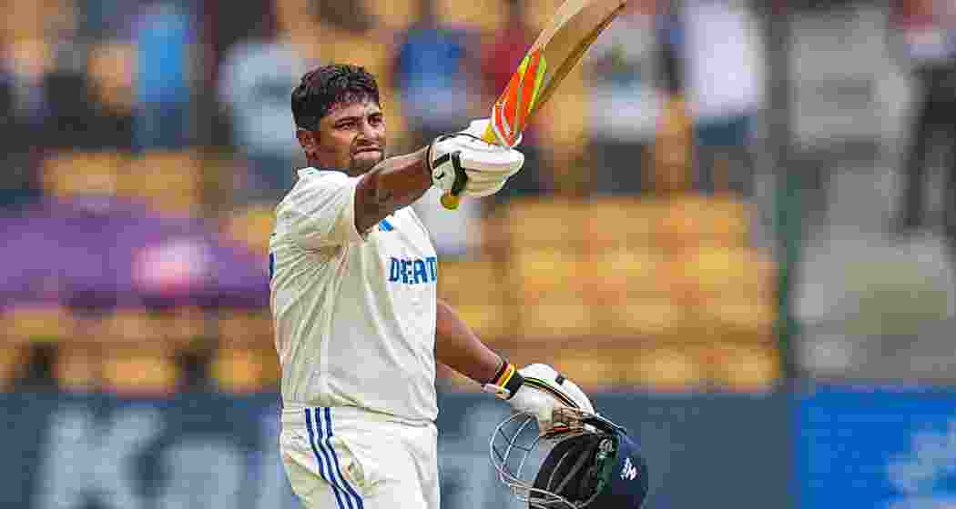 India's Sarfaraz Khan celebrates his century during the fourth day of the first test cricket match between India and New Zealand at M Chinnaswamy Stadium, in Bengaluru, Saturday, Oct 19, 2024. 