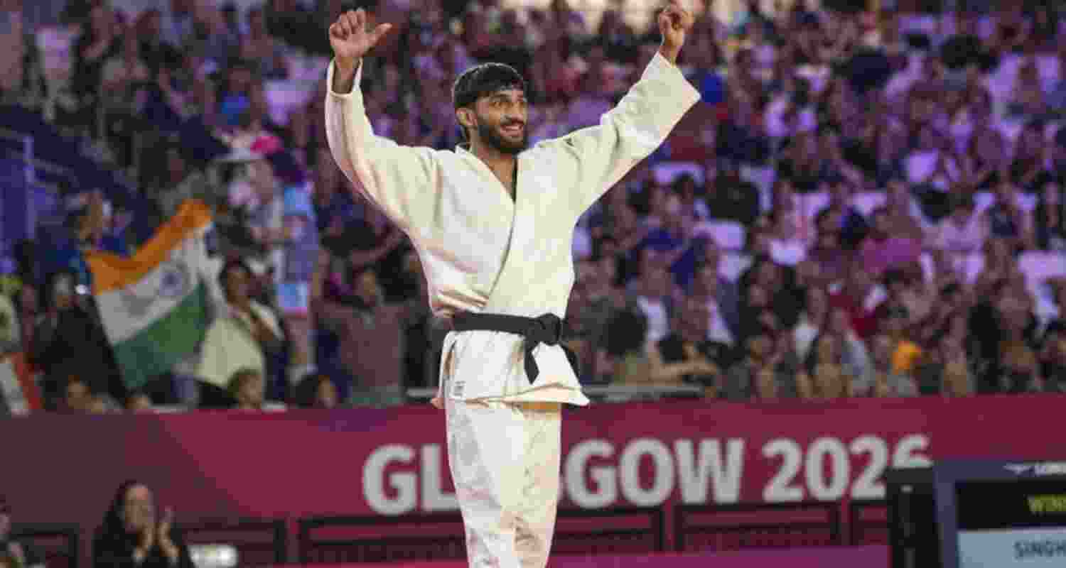 India's Harsh Singh celebrates after winning the men's 60kg final judo match against Australia's Joshua Katz at the 23rd Commonwealth Games in Glasgow, Scotland.