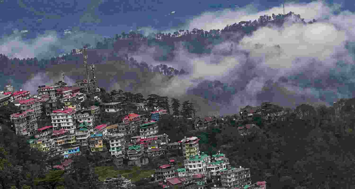  Clouds hover over the hills after rainfall, in Shimla, Himachal Pradesh on Saturday. 