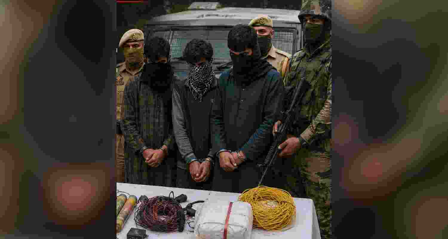 Three men were arrested in Shopian after police recovered grenades, plastic explosives, mobile phones and Hizbul Mujahideen posters.