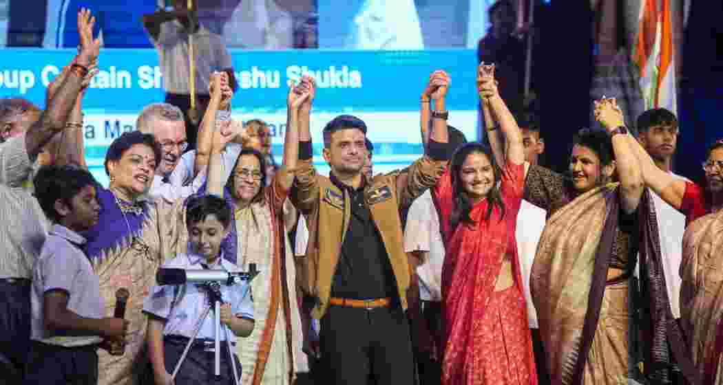 Group Captain Shubhanshu Shukla with his wife Kamna during a felicitation ceremony.