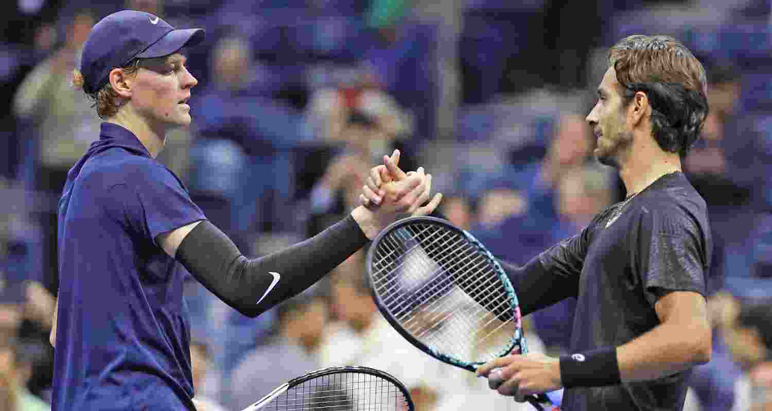 Jannik Sinner and (right) Lorenzo Musetti after their quarterfinal match at the US Open.