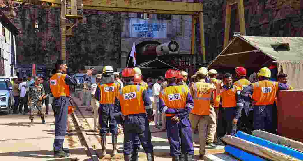 Members of National Disaster Response Force (NDRF) prepare for a rescue operation at Srisailam Left Bank Canal (SLBC) project tunnel in Nagarkurnool district of India's Telangana.