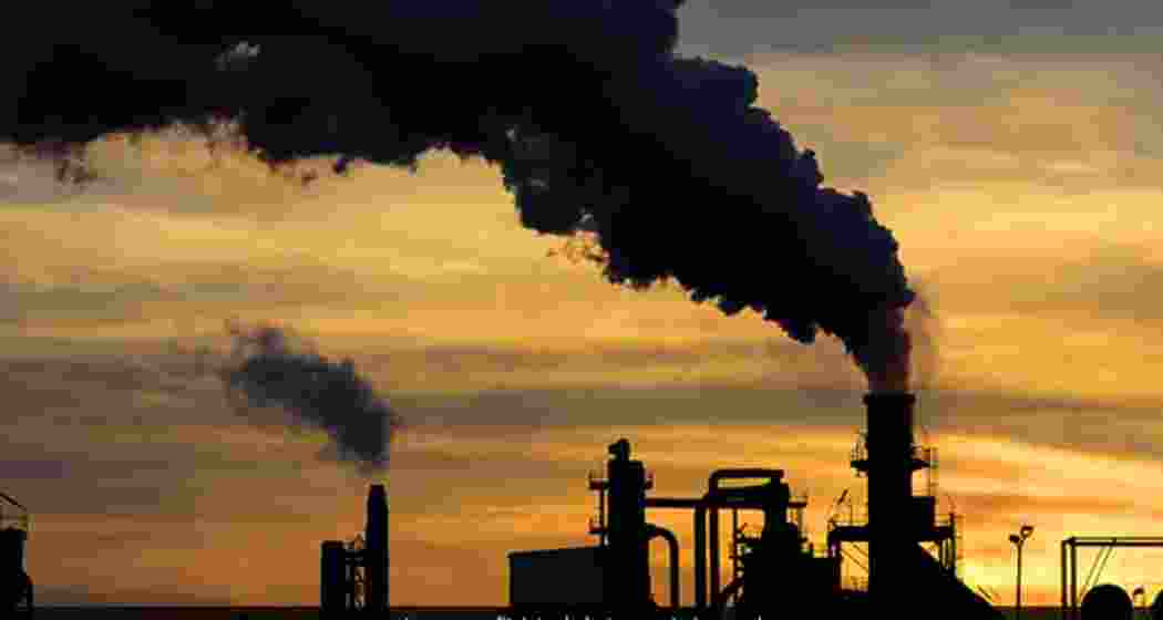 Smoke billows from a crude oil facility. Smoke billows from a crude oil facility.