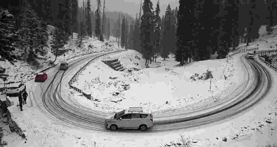 Vehicles ply on the Gulmarg road after a fresh spell. (File photo)
