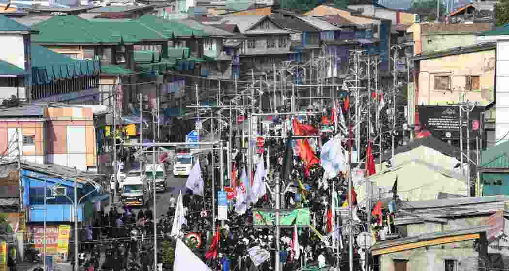 Mourners participate in the 8th Muharram procession in Srinagar on Thursday.