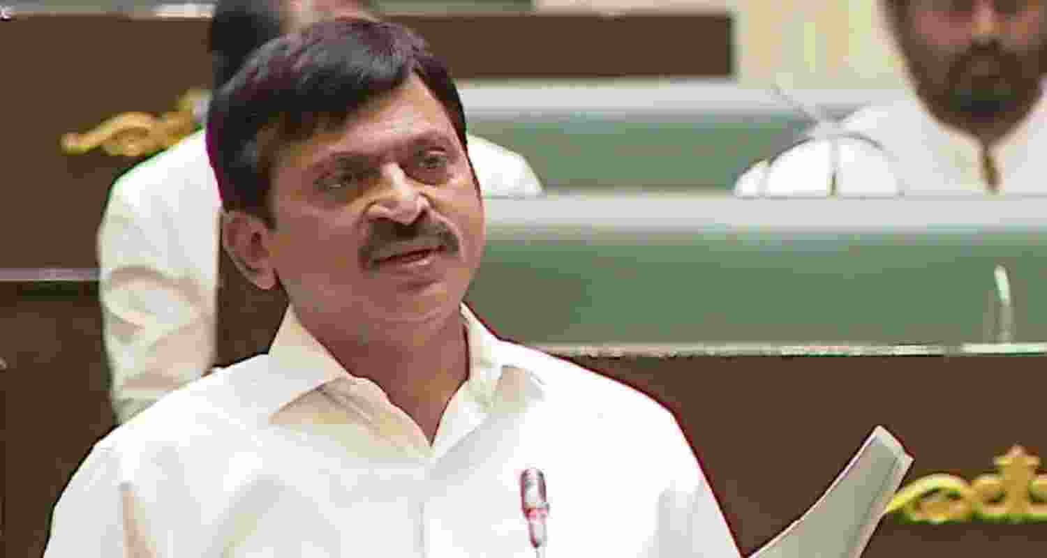 Telangana Revenue Minister P Srinivas Reddy tables the bill in the state assembly.
