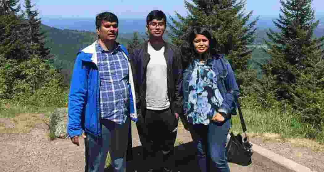 Suchir Balaji, former OpenAI researcher, with parents.
