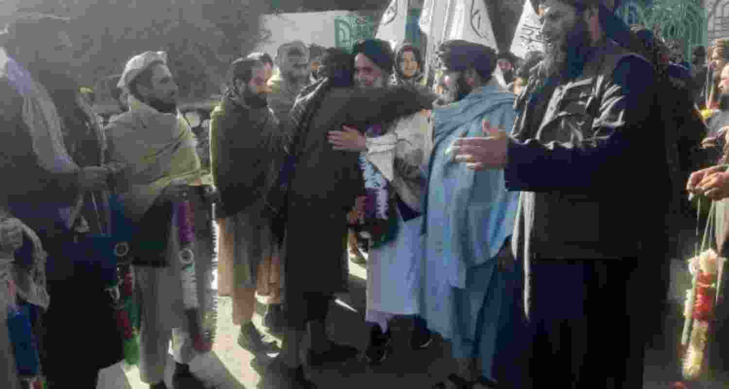 Khan Mohammed, seen in center, welcomed in Jalalabad, Afghanistan, after he was released after a prisoner swap between the United States and Afghanistan's Taliban. 