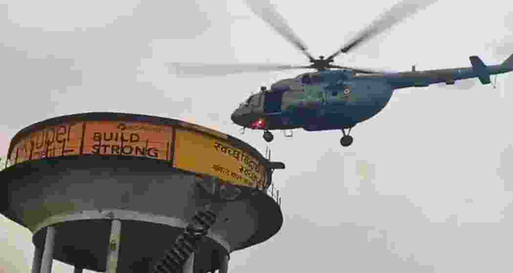 An Indian Air Force helicopter during a rescue operation to airlift stranded children from a water tank in Uttar Pradesh.
