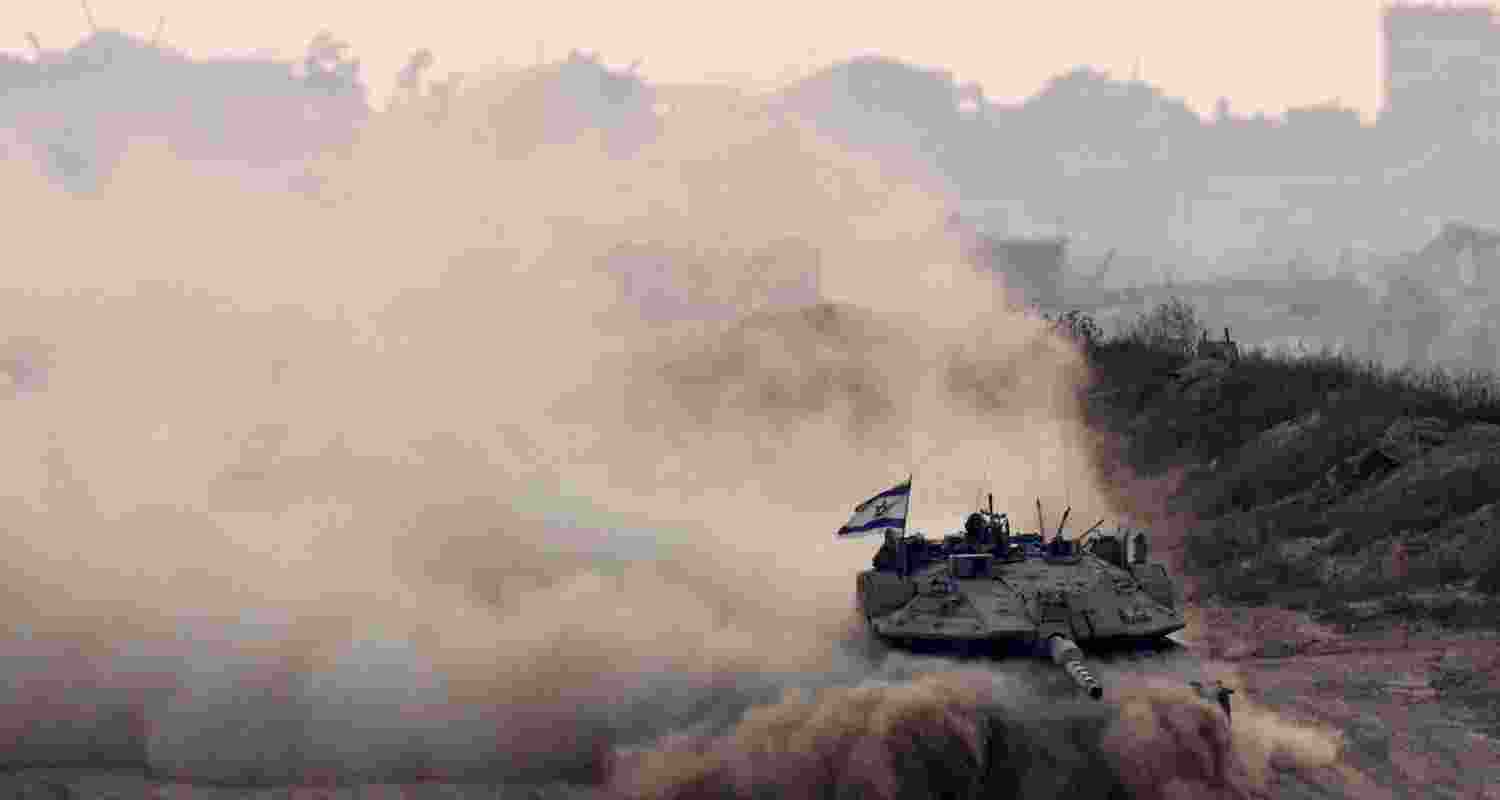 An Israeli tank manoeuvres in Gaza, as seen from the Israeli side of the border.