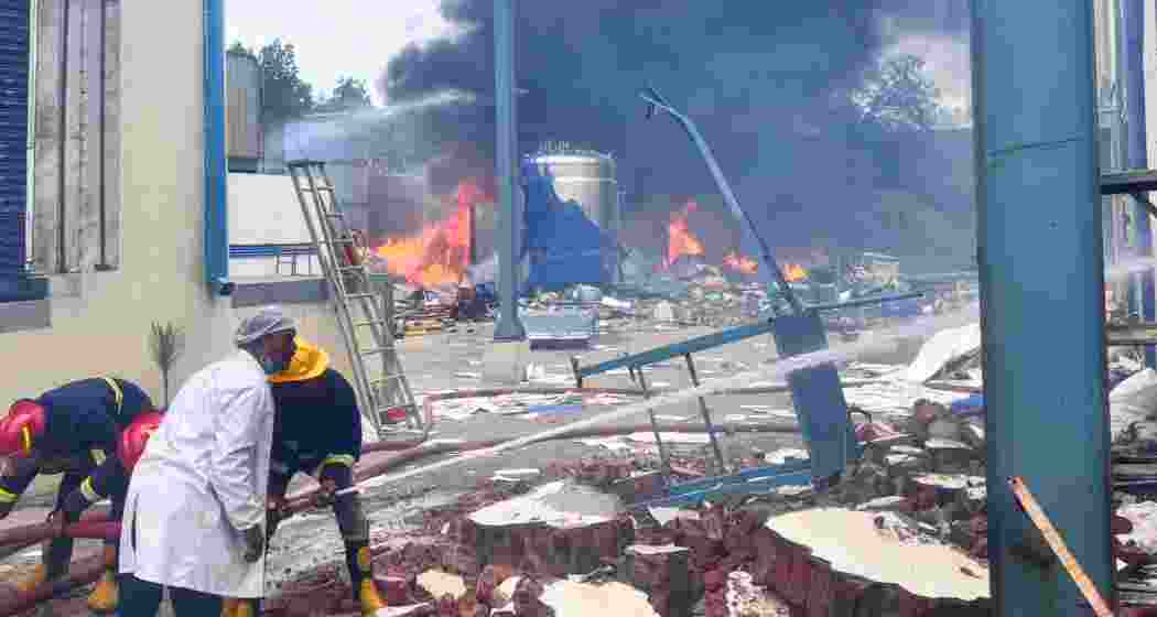 Firefighters and emergency caregivers at Sigachi Industries in Pashamylaram, Telangana, battle flames after a reactor explosion left at least 10 dead and several injured on Monday. Search operations remain ongoing.