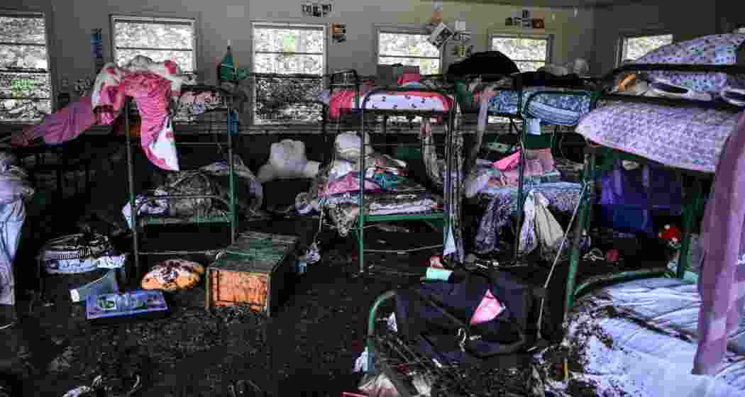 Debris and shattered belongings lie strewn across Camp Mystic in Hunt, Texas, where flash floods on Saturday destroyed cabins and swept through the site, leaving dozens dead and missing.