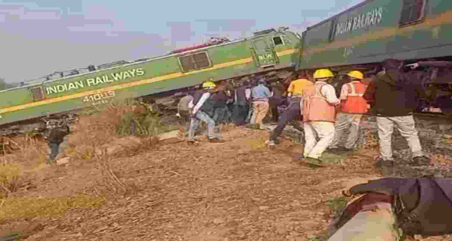 Railway officials at the site after two goods trains collided, near Pambhipur, in Fatehpur district, Uttar Pradesh, Tuesday,