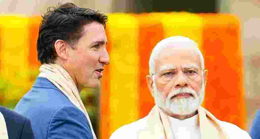 Canada's Prime Minister Justin Trudeau walks past India's Prime Minister Narendra Modi. File photo.