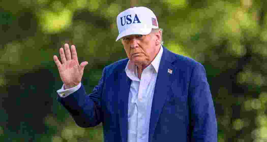 President Donald Trump walks across the South Lawn of the White House.
