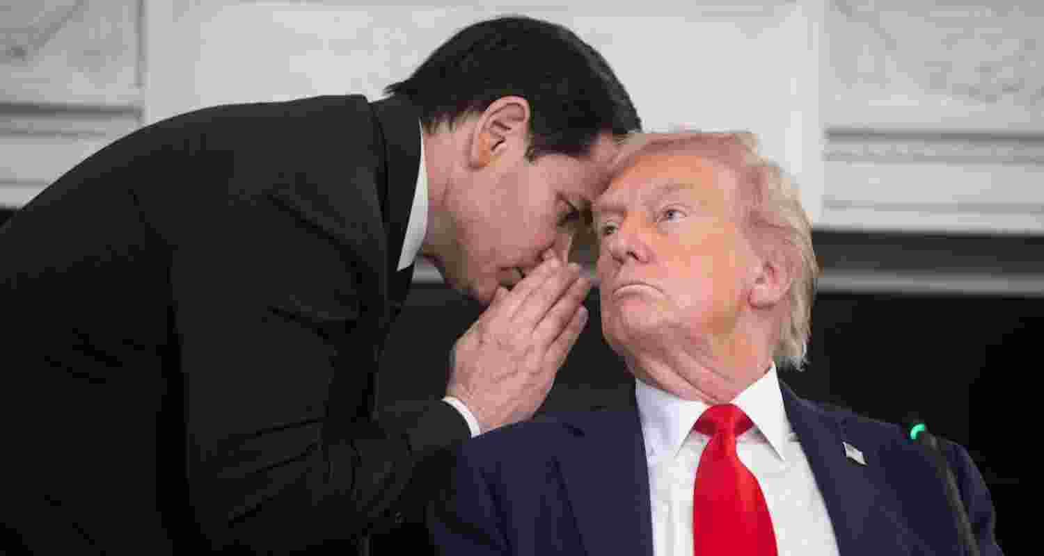 US Secretary of State Marco Rubio (left) whispers to President Donald Trump at the White House on October 8. 