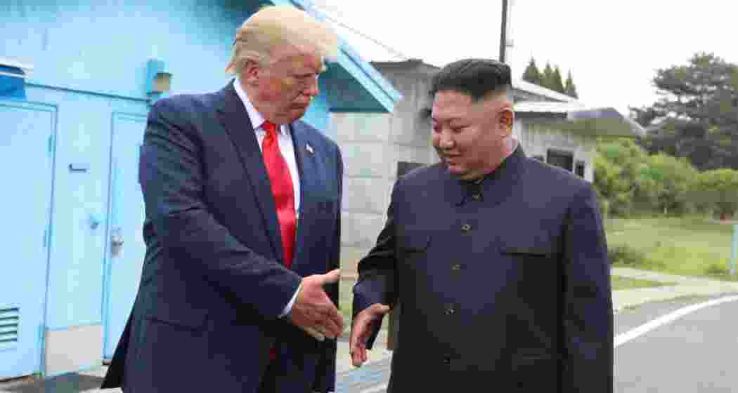 A handout photo from Dong-A Ilbo shows North Korean leader Kim Jong-un and U.S. President Donald Trump inside the Demilitarized Zone (DMZ) at Panmunjom, separating South and North Korea, during their historic meeting on June 30, 2019.