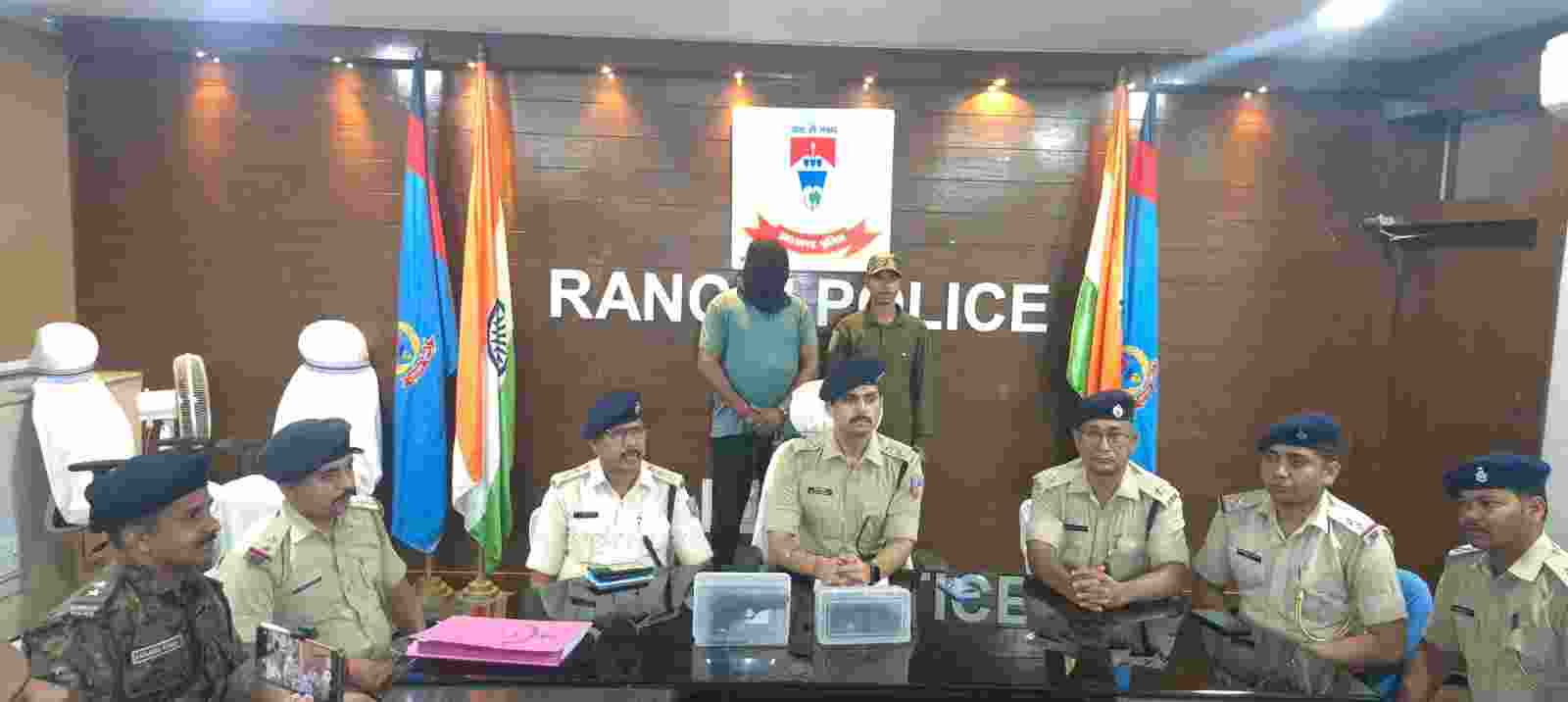 The accused in police custody.