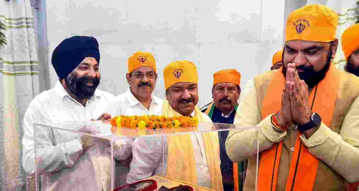 Newly appointed Bihar Chief Minister Samrat Choudhary (R) pays obeisance at Takht Sri Harmandir Sahib Gurudwara, in Patna, on Thursday.