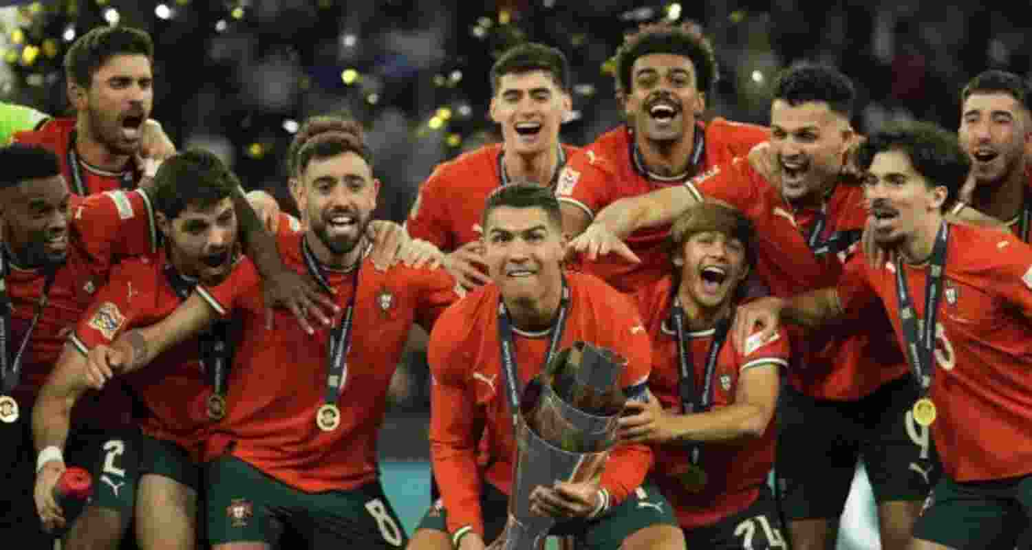 Cristiano Ronaldo celebrates with teammates after winning the UEFA Nations League tournament in Munich.