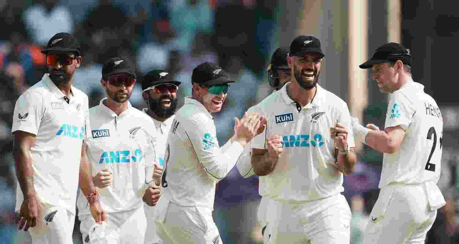 New Zealand's players celebrate the wicket of India's Yashasvi Jaiswal during day three of third Test cricket match between India and New Zealand at Wankhede Stadium, in Mumbai.