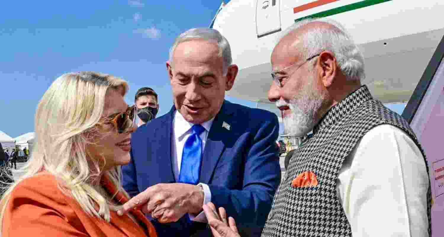 Prime Minister Narendra Modi being welcomed by his Israeli counterpart Benjamin Netanyahu and his wife Sara Netanyahu, near Tel Aviv, Israel, on Wednesday.