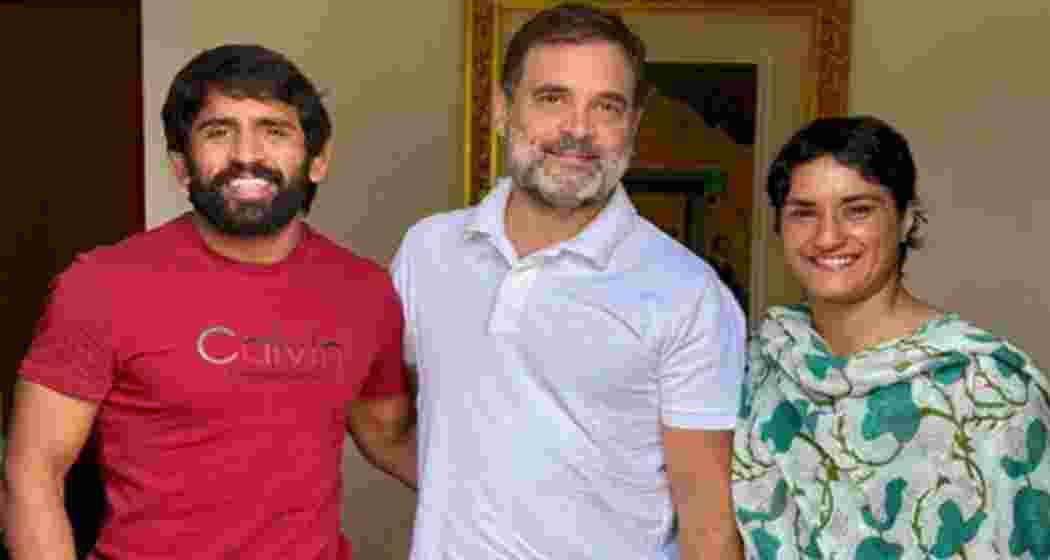 Wrestlers Bajrang Puniya and Vinesh Phogat meet the leader of the opposition in the Lok Sabha Rahul Gandhi in New Delhi. 