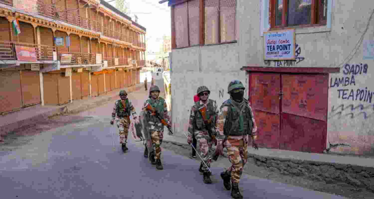 Security personnel patrol an area during a curfew in Leh, Ladakh.