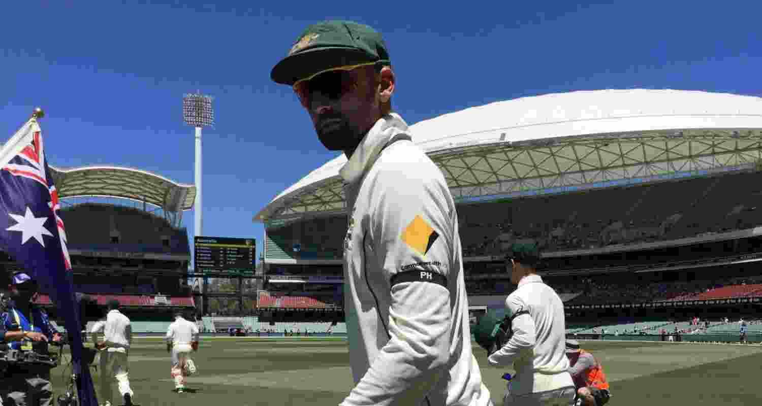 Australia player Steve Smith wearing a black armband to commemorate Philip Hughes. Image: X.