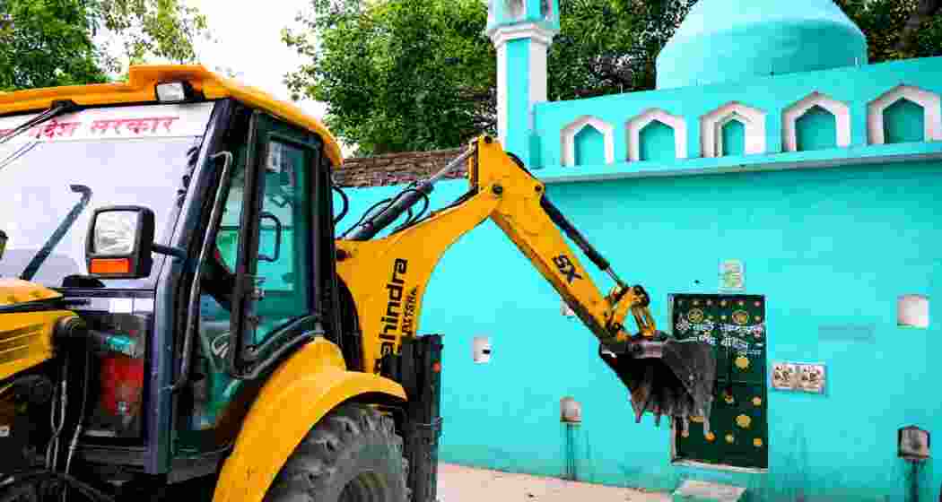 A bulldozer demolish a mosque in Uttar Pradesh's Sambhal district on Saturday as part of the state government's anti-encroachment and eviction drive targeting structures allegedly built on government land.