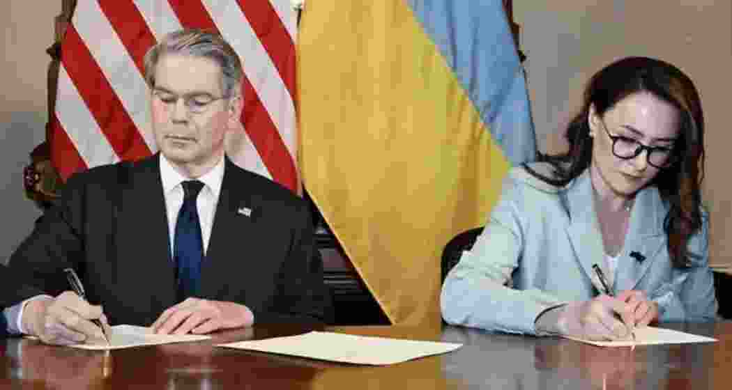 Scott Bessent, the U.S. Treasury secretary, and Yulia Svyrydenko, a Ukraine deputy minister, signing the minerals deal.