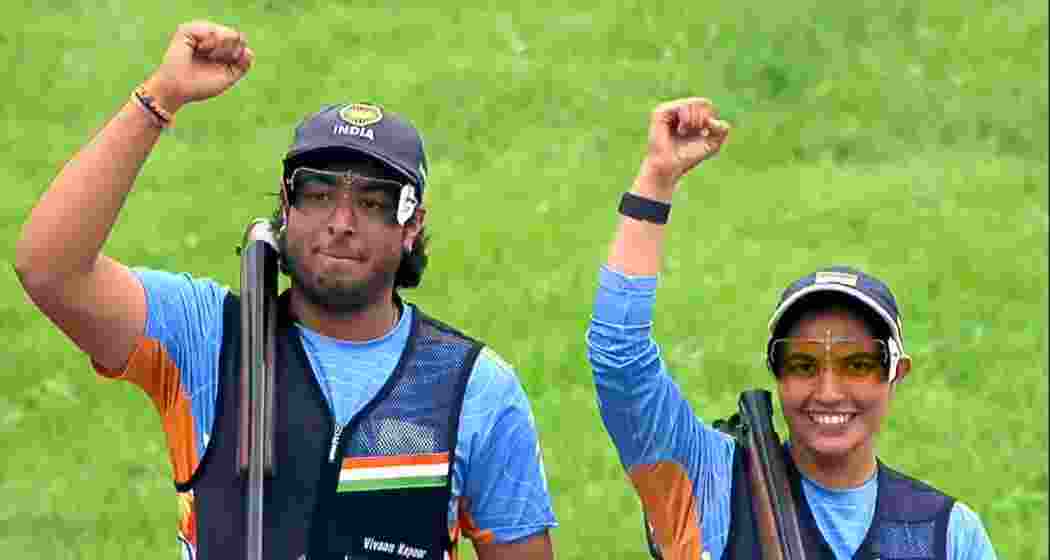 Neeru Dhanda (R) and Vivaan Kapoor celebrate after winning bronze in the trap mixed team event at the ISSF World Cup Shotgun in Almaty on Sunday.