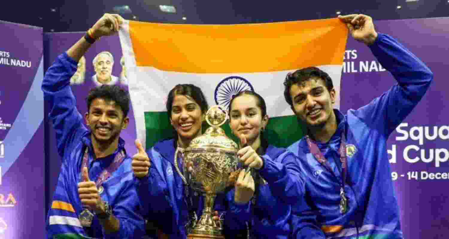 An elated Indian team posing with the Squash World Cup trophy in Chennai.