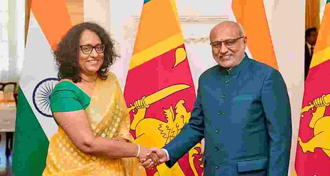 Vice President C.P. Radhakrishnan (R) with Sri Lankan Prime Minister Harini Amarasuriya in Colombo. 