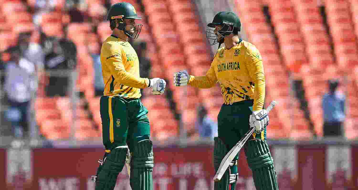 Ryan Rickelton and Quinton de Kock celebrating their century stand.