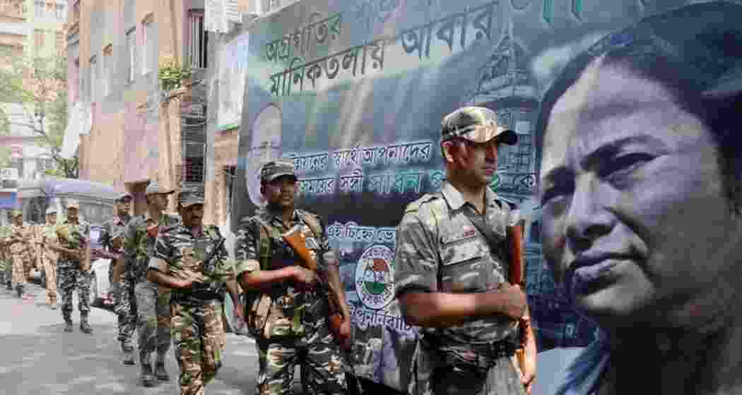 Security personnel conduct a flag march ahead of Assembly elections in West Bengal. The number of polling phases will depend on the availability of central armed police forces. (PTI Photo)