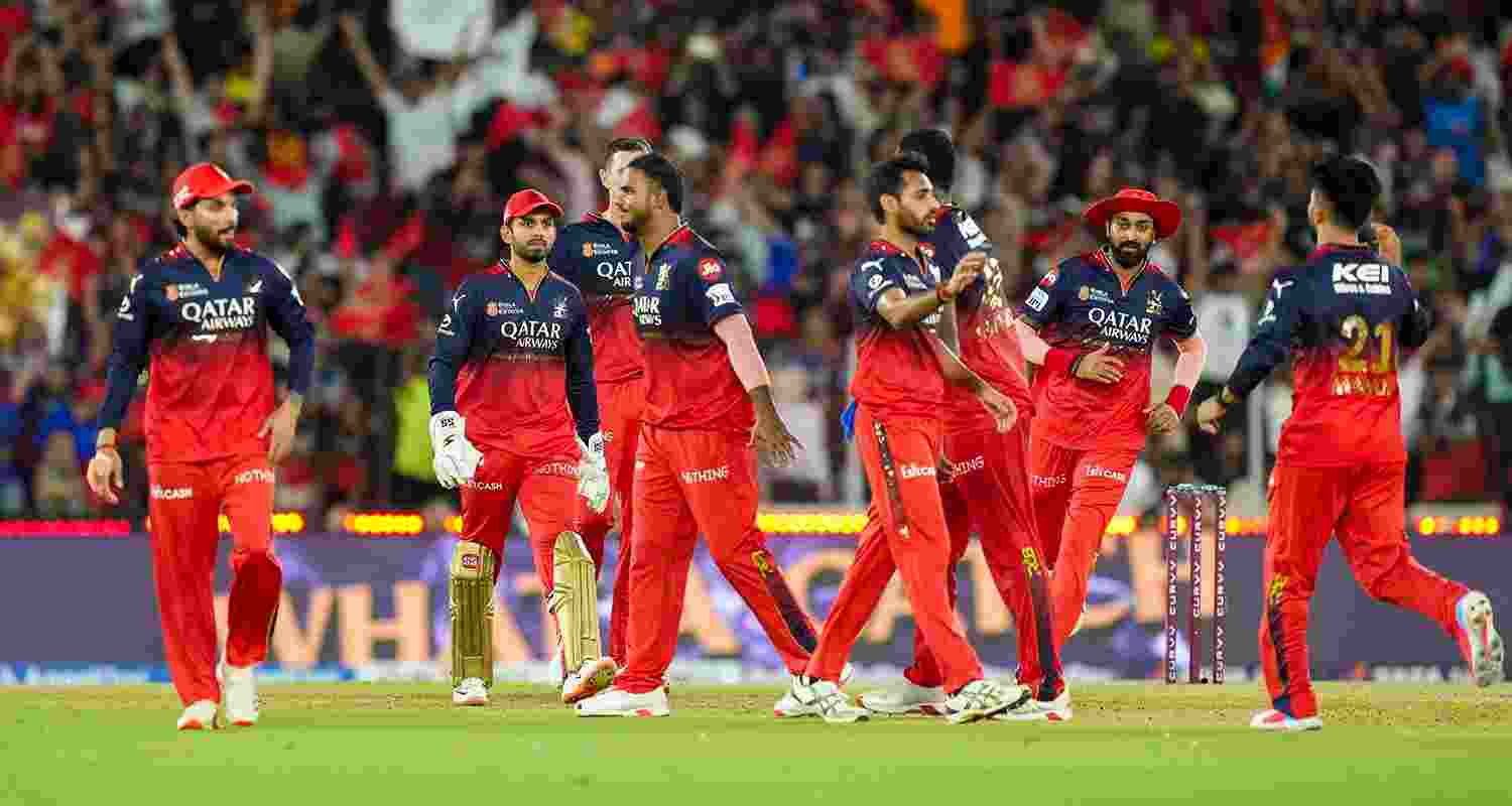 Royal Challengers Bengaluru's Bhuvneshwar Kumar celebrates with teammates after taking the wicket of Punjab Kings' Marcus Stoinis during the IPL 2025 T20 final cricket match between Royal Challengers Bengaluru and Punjab Kings, at the Narendra Modi Stadium in Ahmedabad on Tuesday.